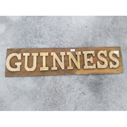 1274 - Guinness wooden advertising board. {24 cm H x 99 cm W}.