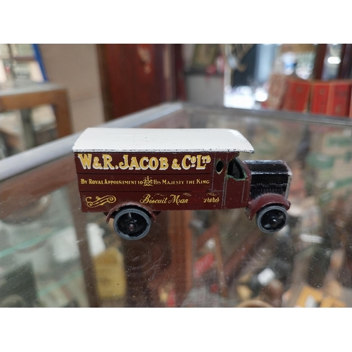 1294 - John Smith brass barrel cask ring {2 cm H x 7 cm Dia} and W R Jacob die cast advertising truck. {3 c... 