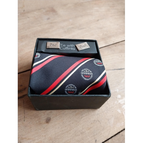 1306 - Guinness Cuff links set and Guinness Tie in presentation box. {6 cm H x 10 cm W x 10 cm D}