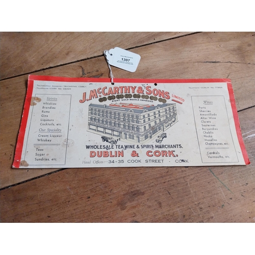 1307 - J McCarthy and Sons Wholesale Wine Merchants Dublin and Cork showcard. {14 cm H x 31 cm W}.