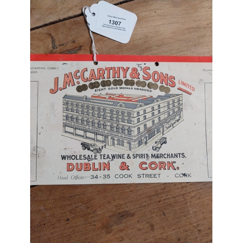 1307 - J McCarthy and Sons Wholesale Wine Merchants Dublin and Cork showcard. {14 cm H x 31 cm W}.