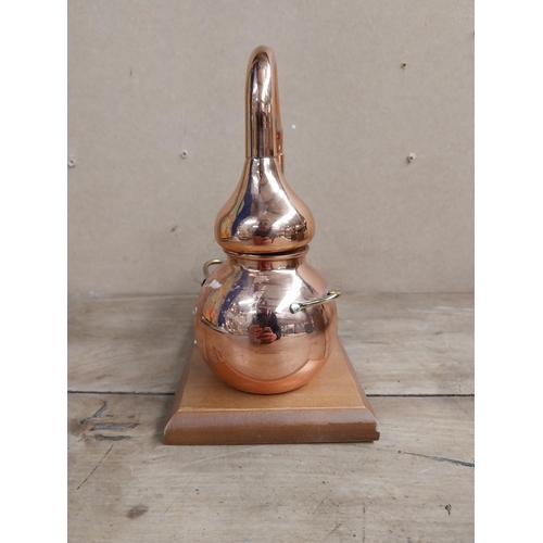 1317 - Copper Model of Still on wooden plinth. {22 cm H x 19 cm W x 12 cm D}.