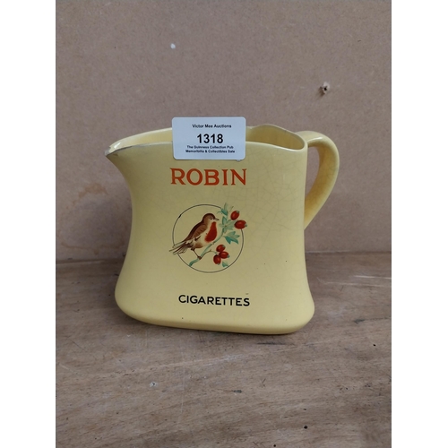 1318 - Robin Cigarettes ceramic water jug. {12 cm H x 13 cm W x 11 cm D}.