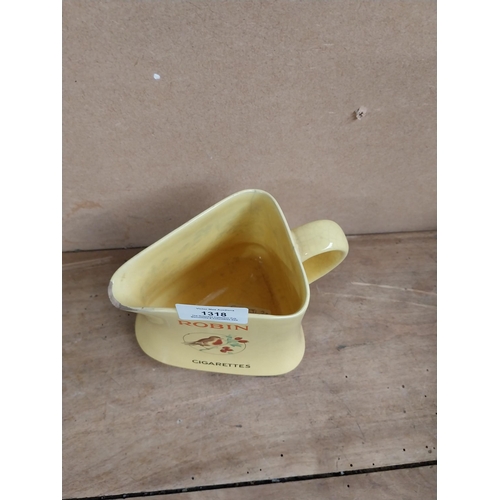 1318 - Robin Cigarettes ceramic water jug. {12 cm H x 13 cm W x 11 cm D}.