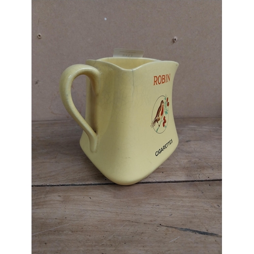 1318 - Robin Cigarettes ceramic water jug. {12 cm H x 13 cm W x 11 cm D}.