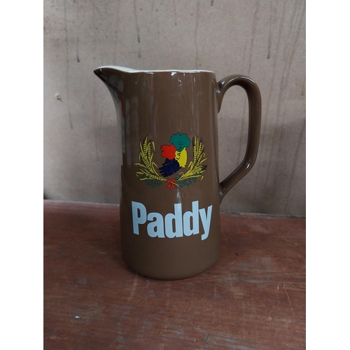 132 - Two Paddy Irish Whiskey Wade advertising water jugs. {16 cm H x 14 cm W x 9 cm D}.