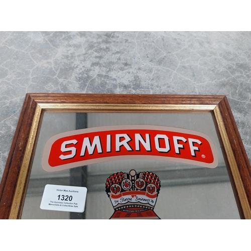 1320 - Smirnoff Vodka framed advertising mirror. {34 cm H x 24 cm W}.