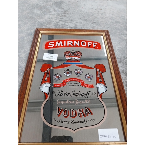 1320 - Smirnoff Vodka framed advertising mirror. {34 cm H x 24 cm W}.