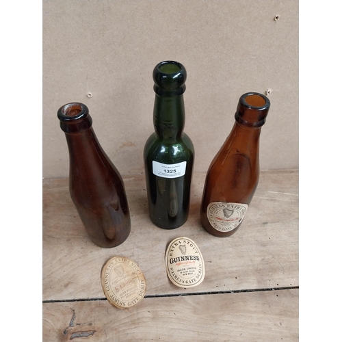 1325 - Three Guinness bottles - Hennessy Ferbane, James McDaid Ramelton, Jacob Limited New Ross. {23 cm H x... 