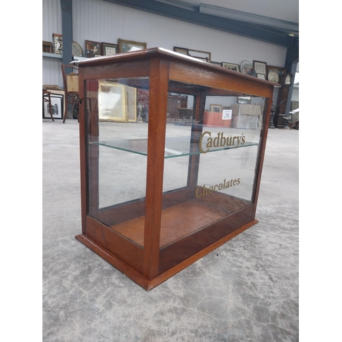 1342 - Cadbury's Chocolate mahogany and glass counter display cabinet. {42 cm H x 48 cm W x 27 cm D}.