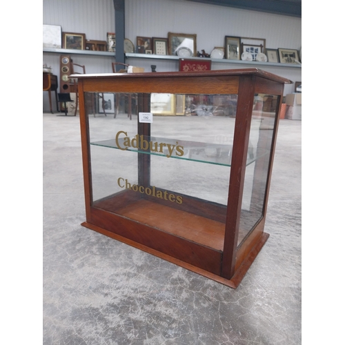 1342 - Cadbury's Chocolate mahogany and glass counter display cabinet. {42 cm H x 48 cm W x 27 cm D}.