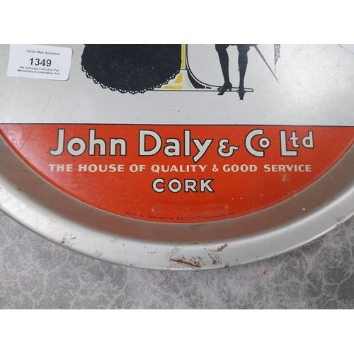 1349 - John Daly and Co Cork The House of Good Quality and Service tinplate tray. {2 cm H x 32 cm Dia.}.