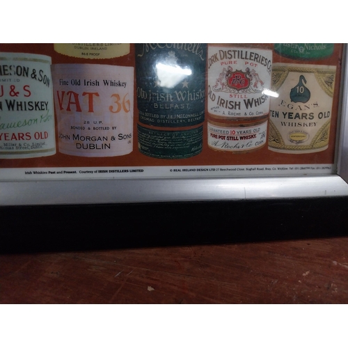 135 - Framed montage  print of Irish and Scotch Whiskey labels. {50 cm H x 37 cm W}.