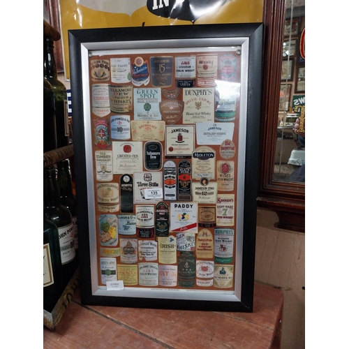 135 - Framed montage  print of Irish and Scotch Whiskey labels. {50 cm H x 37 cm W}.