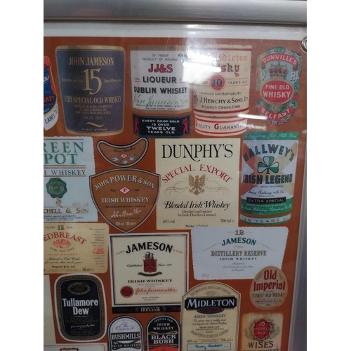 135 - Framed montage  print of Irish and Scotch Whiskey labels. {50 cm H x 37 cm W}.