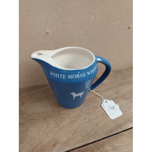 1352 - White Horse Whiskey ceramic water jug. {14 cm H x 18 cm W x 10 cm D}.