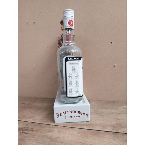 1353 - Jim Beam Kentucky Bourbon ceramic advertising bottle holder in the form of a Cowboy and bottle. {34 ... 