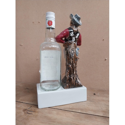 1353 - Jim Beam Kentucky Bourbon ceramic advertising bottle holder in the form of a Cowboy and bottle. {34 ... 