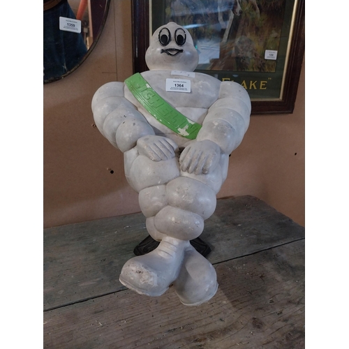 1364 - Michelin Man advertising figure on metal stand. {49 cm H x 29 cm W}