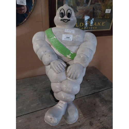 1364 - Michelin Man advertising figure on metal stand. {49 cm H x 29 cm W}