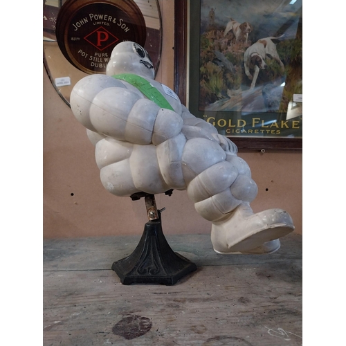 1364 - Michelin Man advertising figure on metal stand. {49 cm H x 29 cm W}