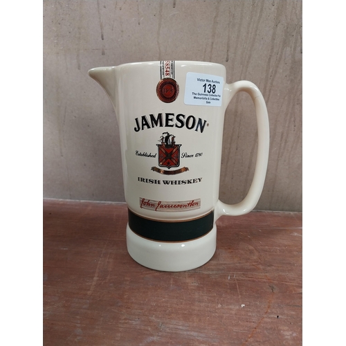 138 - Bushmills Whiskey Arklow advertising jug {11 cm h x 15 cm W x 11 cm D} and Jameson Whiskey Eastgate ... 