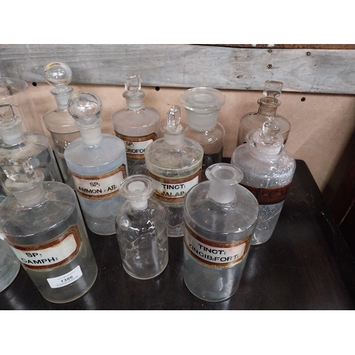 1386 - Fifteen 19th C. glass chemist bottles, some with labels. {18 cm H} approx.