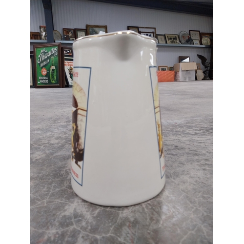 1395 - Guinness ceramic advertising water jug. {32 cm H x 18 cm W x 15 cm D}.