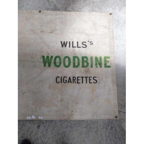 1417 - Wills's Woodbine cigarettes advertising banner. {119 cm H x 227 cm W}.