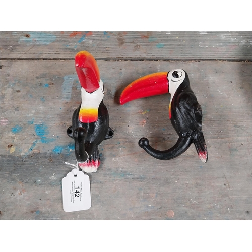 142 - Cast iron Toucans in the form of coat hangers. {16 cm H x 7 cm W}.