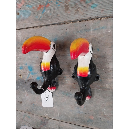 142 - Cast iron Toucans in the form of coat hangers. {16 cm H x 7 cm W}.