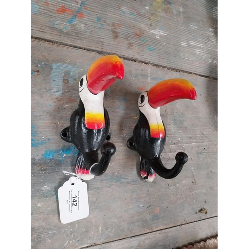 142 - Cast iron Toucans in the form of coat hangers. {16 cm H x 7 cm W}.