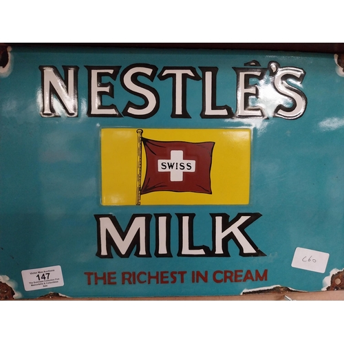 147 - Nestle's Swiss Milk enamel advertising sign. {24 cm H x 36 cm W}.