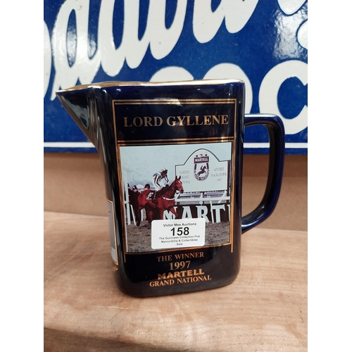 158 - Set of three graduated Martell Grand National winners ceramic water jugs. {15 cm H  to 13 cm H}.