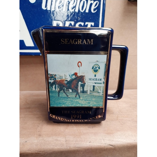 158 - Set of three graduated Martell Grand National winners ceramic water jugs. {15 cm H  to 13 cm H}.