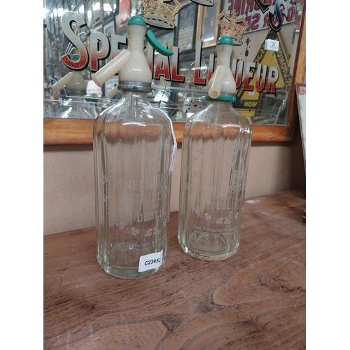 16 - Two Dublin Mineral Waters glass siphons. {20 cm H}.