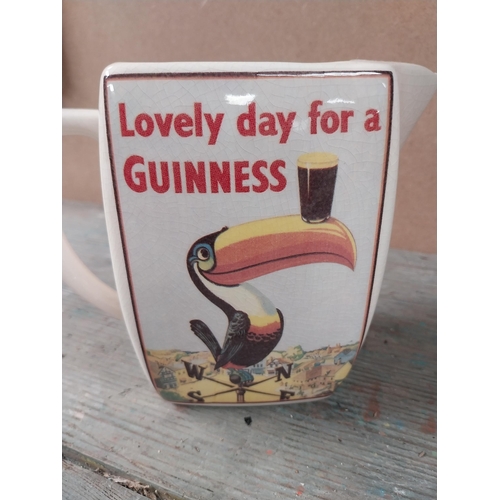 164 - Two Guinness advertising water jugs Lovely day for a Guinness Staffordshire and Carrigaline pottery.... 