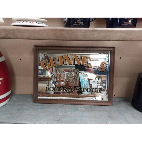 166 - Framed Guinness Extra Stout advertising mirror. {34 cm H x 47 cm W}.