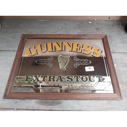 166 - Framed Guinness Extra Stout advertising mirror. {34 cm H x 47 cm W}.