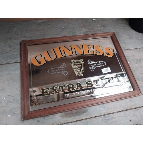 166 - Framed Guinness Extra Stout advertising mirror. {34 cm H x 47 cm W}.