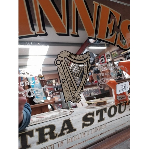 166 - Framed Guinness Extra Stout advertising mirror. {34 cm H x 47 cm W}.