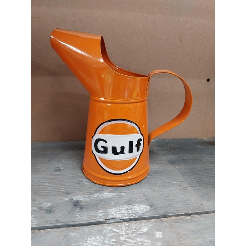 170 - Gulf Petrol tinplate graduated measuring jugs. {27 cm H x 35 cm W x 14 cm D}, {18 cm H x 18 cm W x 1... 