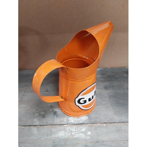 170 - Gulf Petrol tinplate graduated measuring jugs. {27 cm H x 35 cm W x 14 cm D}, {18 cm H x 18 cm W x 1... 