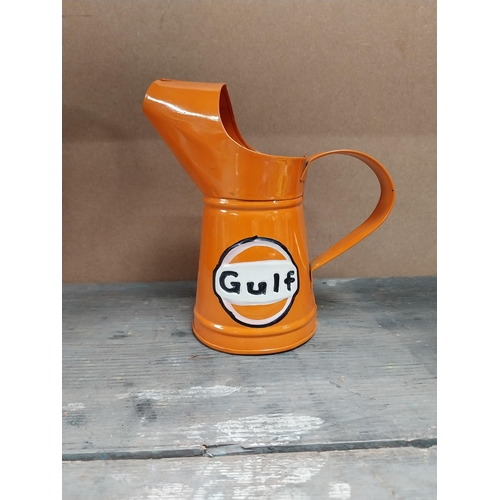 170 - Gulf Petrol tinplate graduated measuring jugs. {27 cm H x 35 cm W x 14 cm D}, {18 cm H x 18 cm W x 1... 