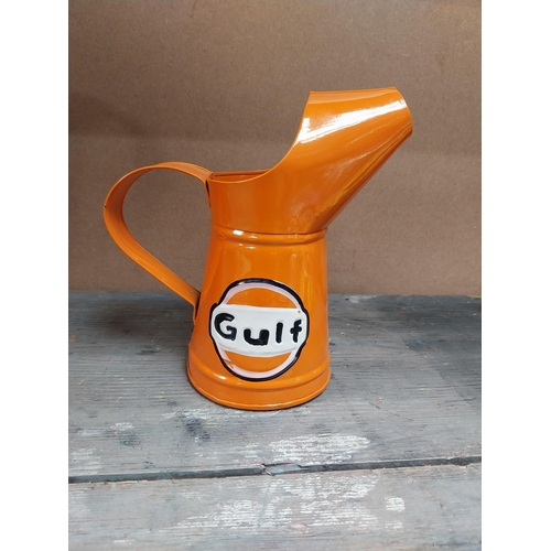 170 - Gulf Petrol tinplate graduated measuring jugs. {27 cm H x 35 cm W x 14 cm D}, {18 cm H x 18 cm W x 1... 