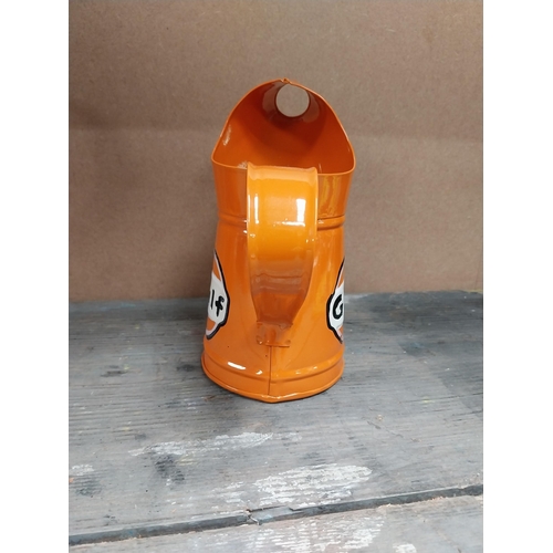 170 - Gulf Petrol tinplate graduated measuring jugs. {27 cm H x 35 cm W x 14 cm D}, {18 cm H x 18 cm W x 1... 