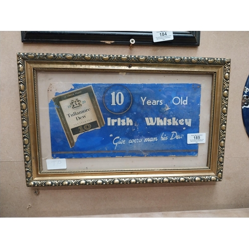 185 - Tullamore Dew Give Every Man His Dew framed showcard. {25 cm H x 40 cm W}.