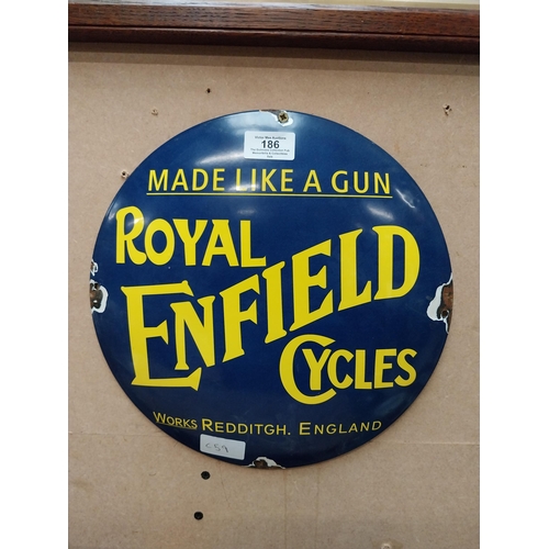 186 - Made like a Gun Royal Enfield Cycles enamel advertising sign. {30 cm Dia.}.