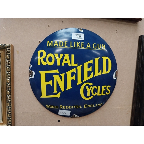 186 - Made like a Gun Royal Enfield Cycles enamel advertising sign. {30 cm Dia.}.