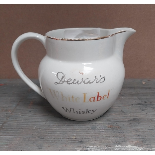 192 - Dewars White Label Whisky {10 cm H }and Johnny Walker Whisky {13 cm H} ceramic water Jugs